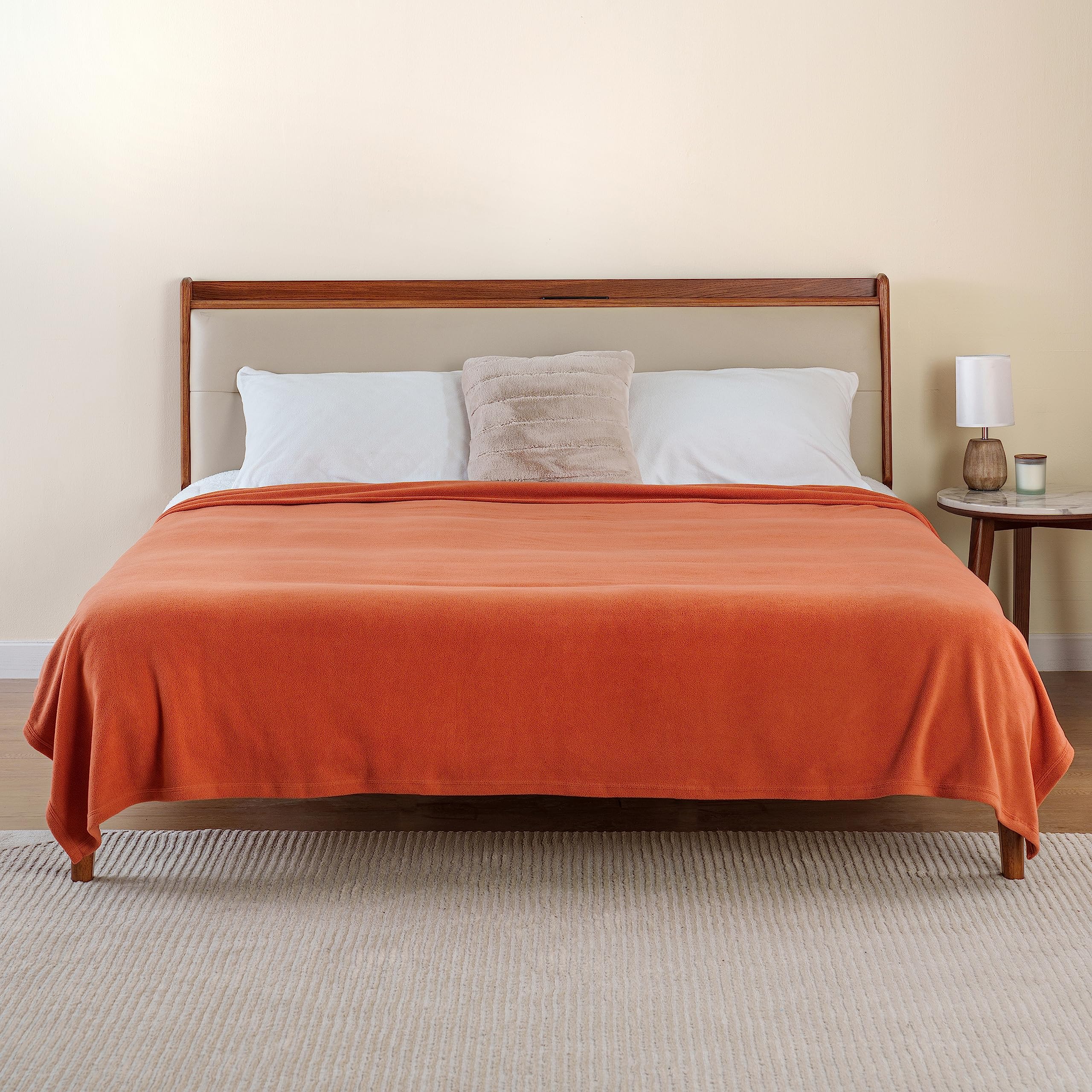 Berkshire Blanket used on sofa in living room showing vibrant color and comfort
