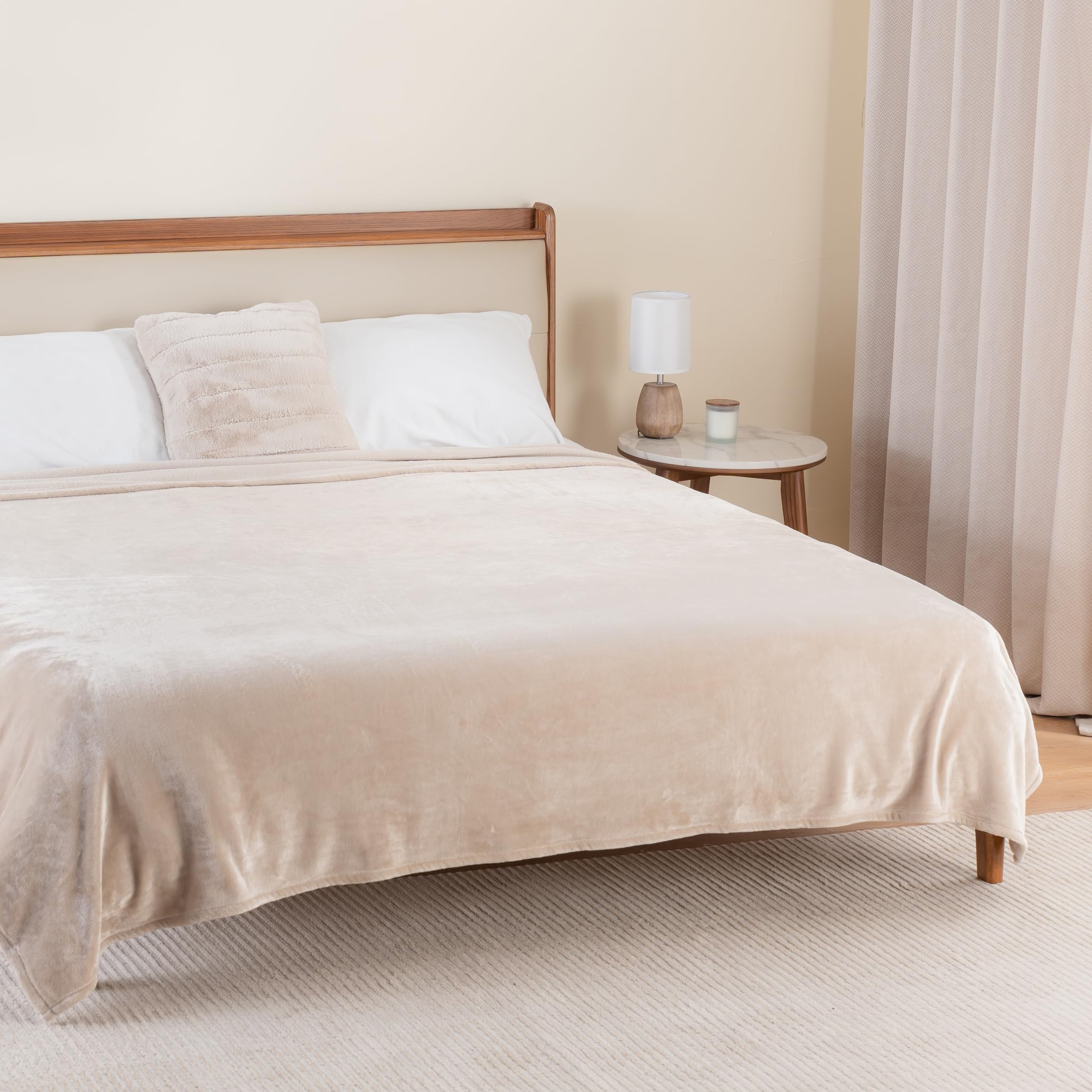 Berkshire Blanket draped over a couch offering cozy decor and everyday use