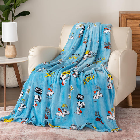 Berkshire Blanket folded in hands demonstrating 55x70 size and easy portability
