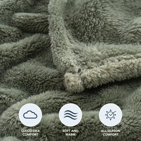 Berkshire Blanket draped on queen bed providing generous warmth and style