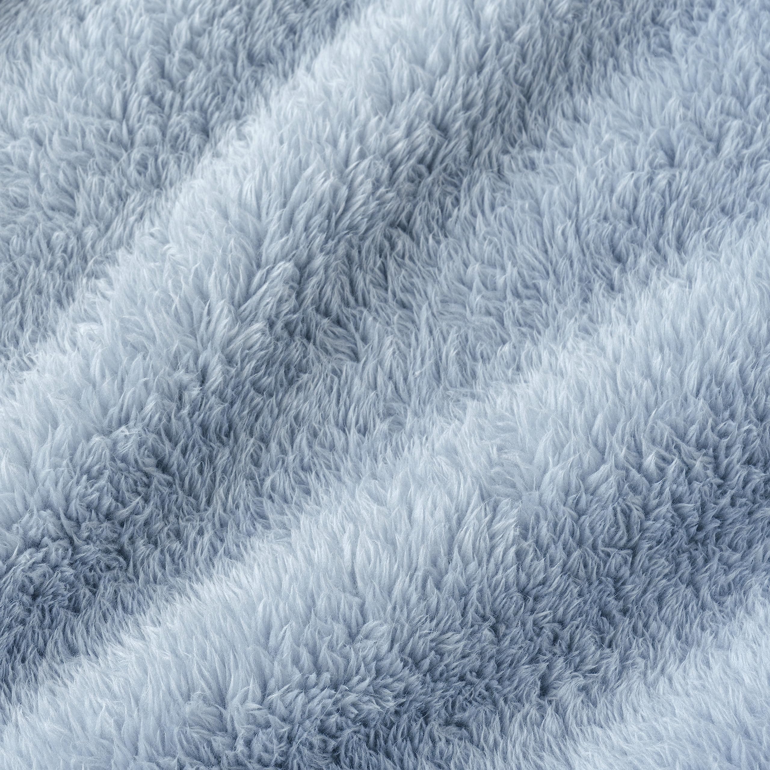 Berkshire Blanket on patio chaise showing outdoor-lounge warmth and style