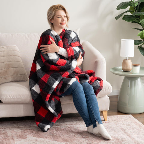 Berkshire Blanket pocket detail with hands demonstrating storage and convenience