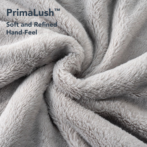 Berkshire Blanket worn seated demonstrating comfort while reading or relaxing