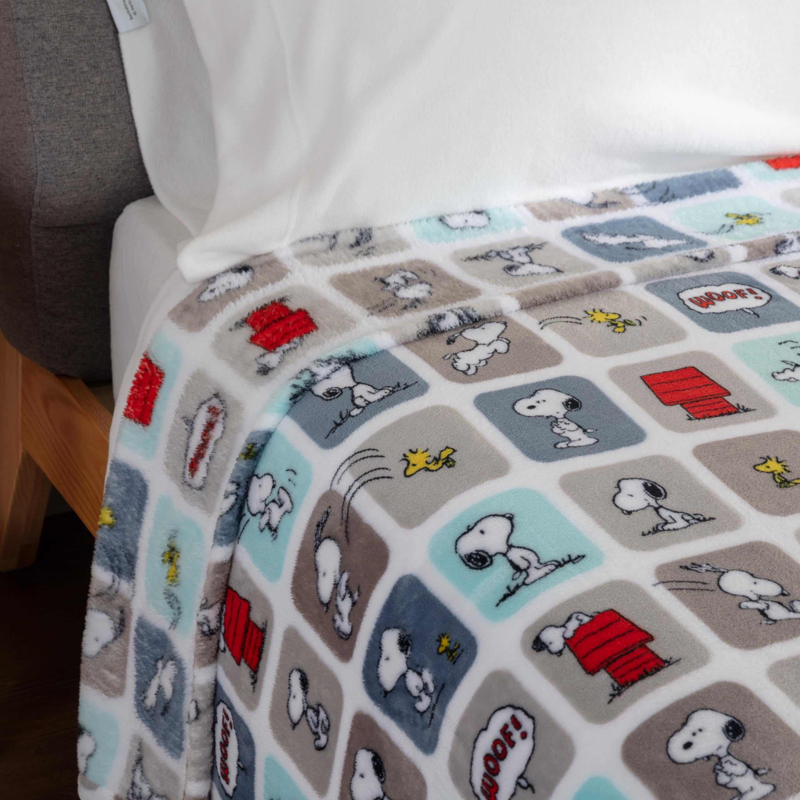 Berkshire Blanket Snoopy care label showing machine-wash benefit and durability