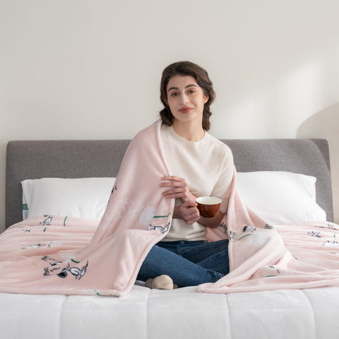 Berkshire Blanket fully spread displaying Snoopy design and generous king size