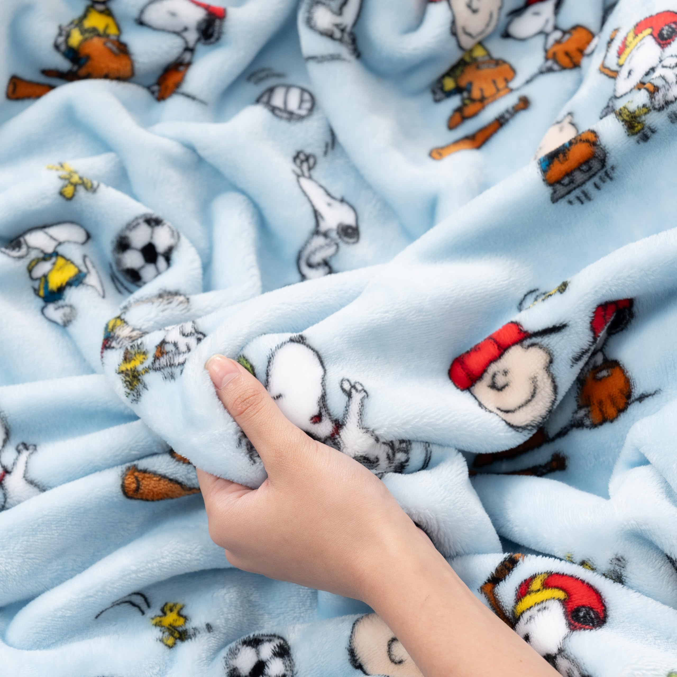 Berkshire Blanket Snoopy washcare tag closeup indicates easy machine-wash maintenance