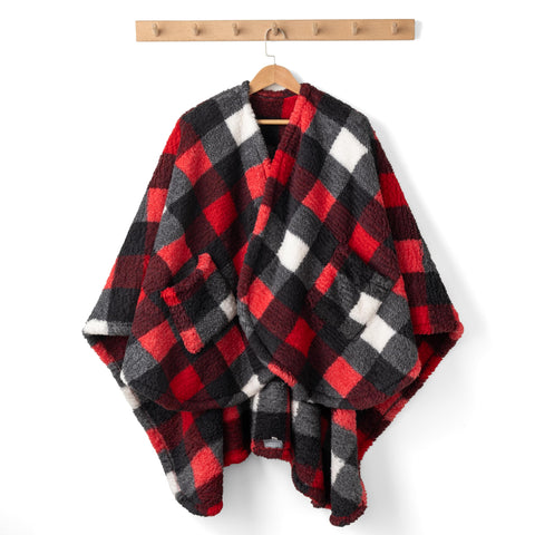 Person wearing Berkshire Blanket on couch illustrating mobility and cozy lounging