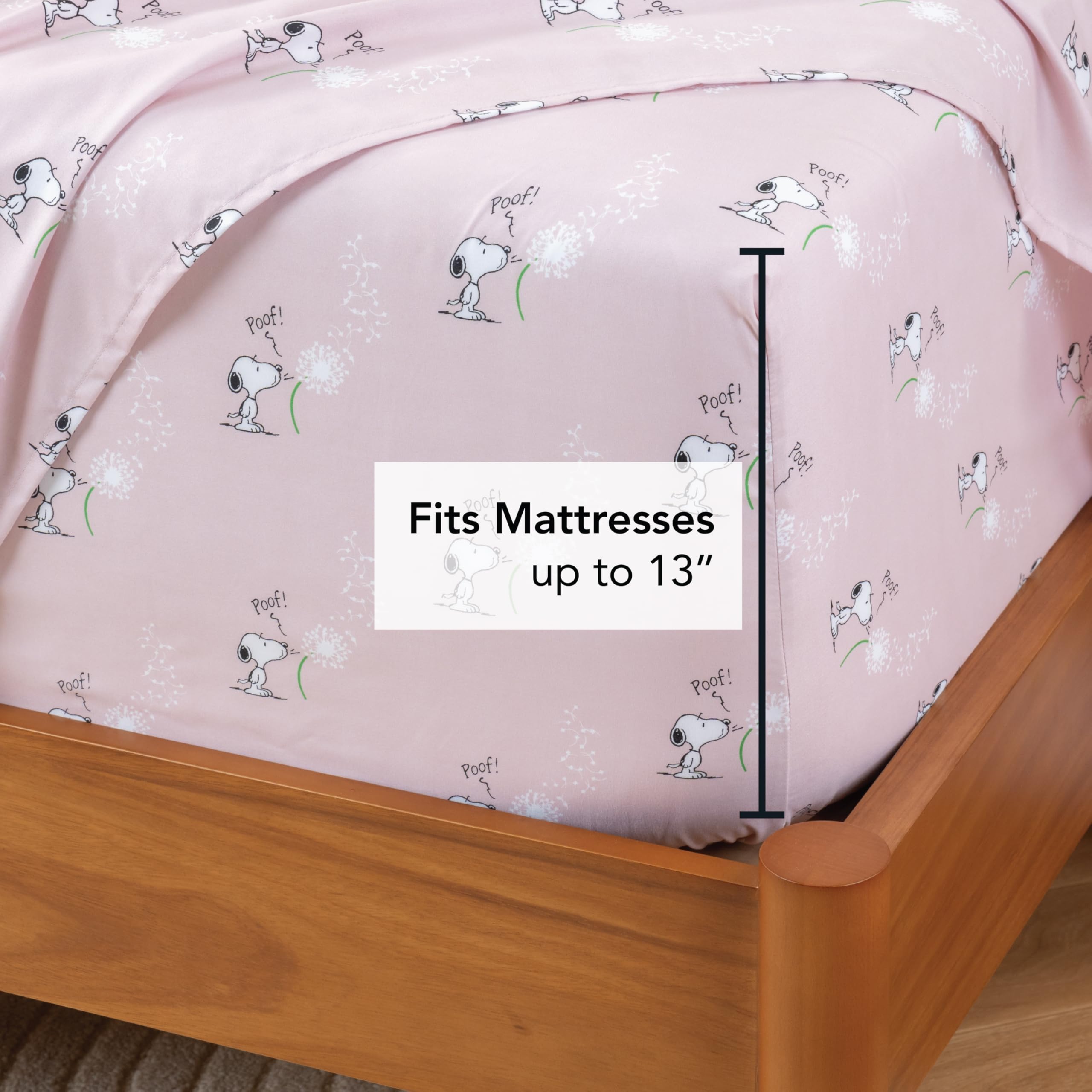 Berkshire Peanuts flat sheet fully spread on bed showing spring-pink Make A Wish pattern
