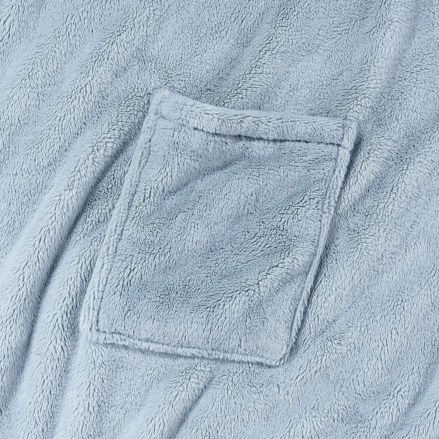 Berkshire Blanket on sofa showing 58x64 size and generous coverage