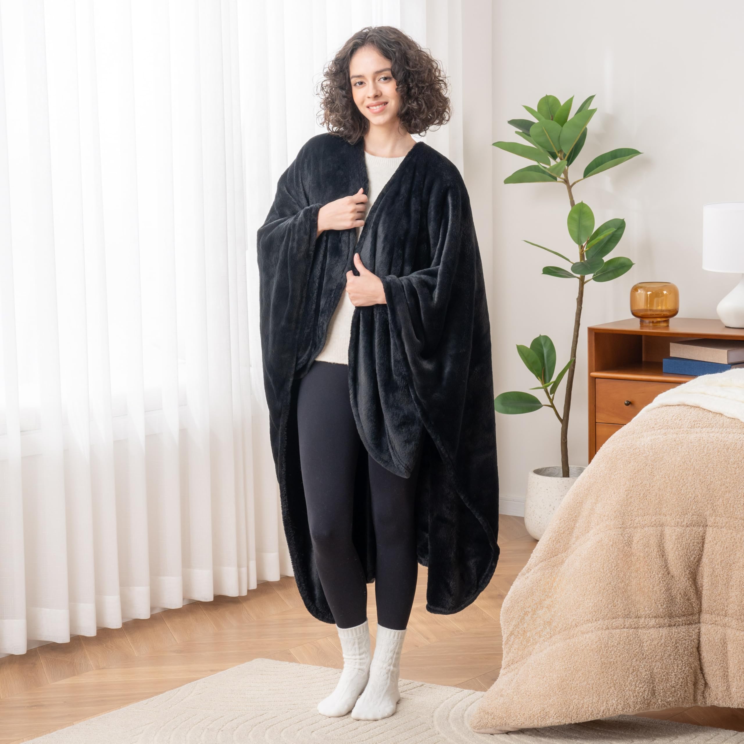 Berkshire Blanket lifestyle photo worn in living room offering comfortable mobility