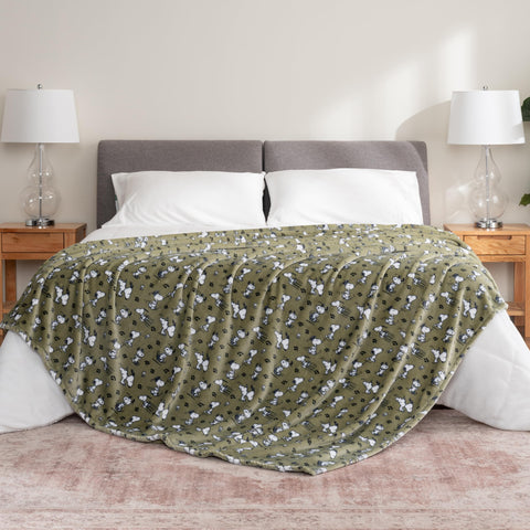 Berkshire Blanket draped on a twin bed showing coverage and decorative impact