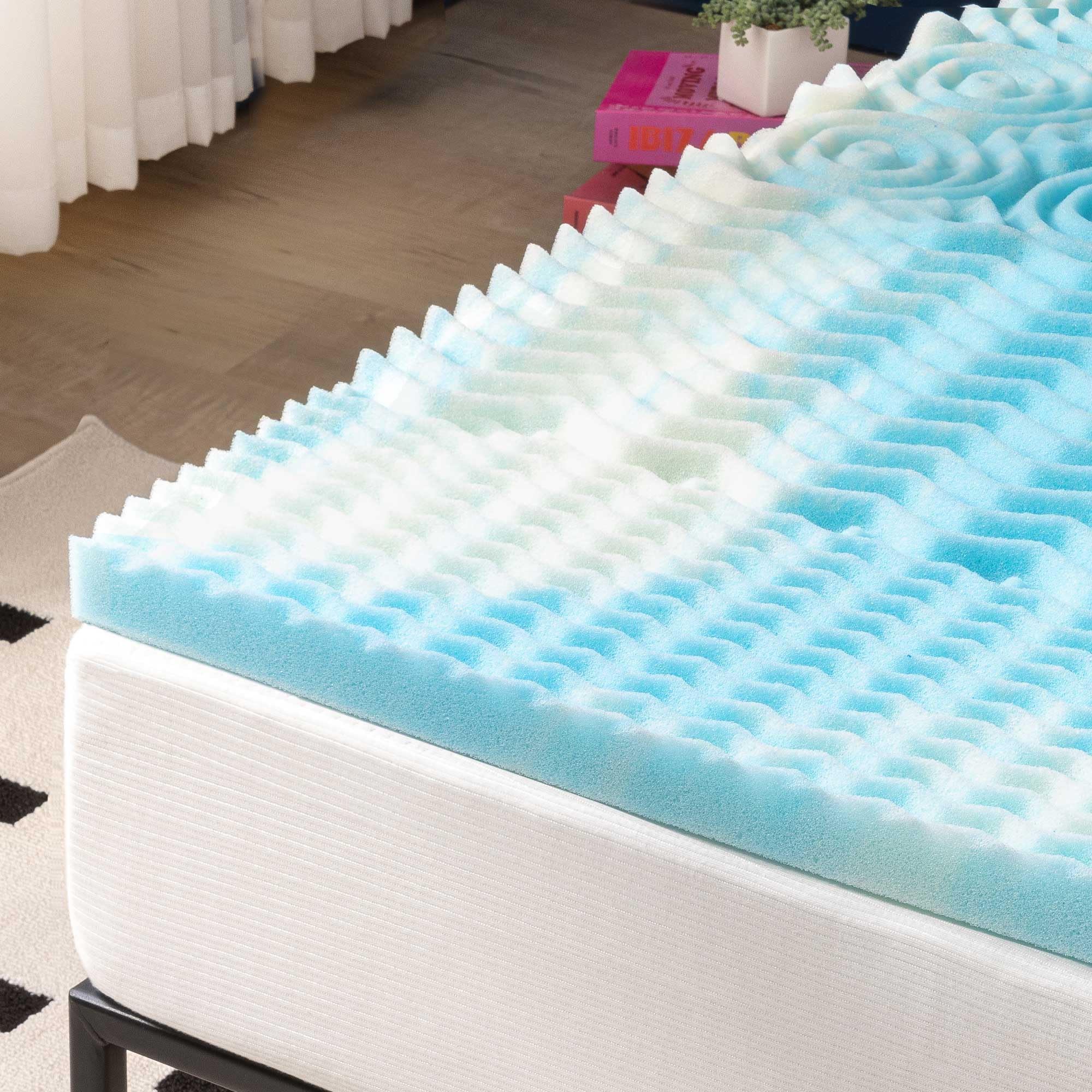 Best Price Mattress topper styled on bed in bedroom, adds visible comfort appeal