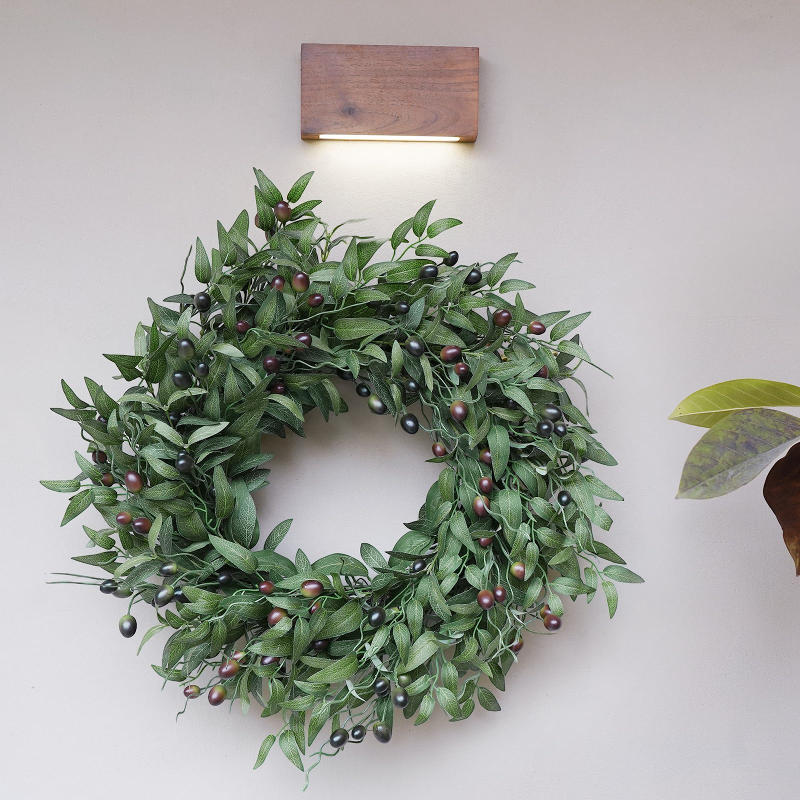 BHHDA wreath next to chair showing 26-inch size and scale