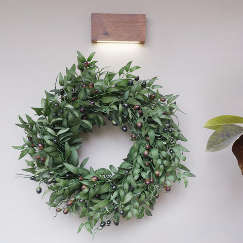 BHHDA wreath next to chair showing 26-inch size and scale