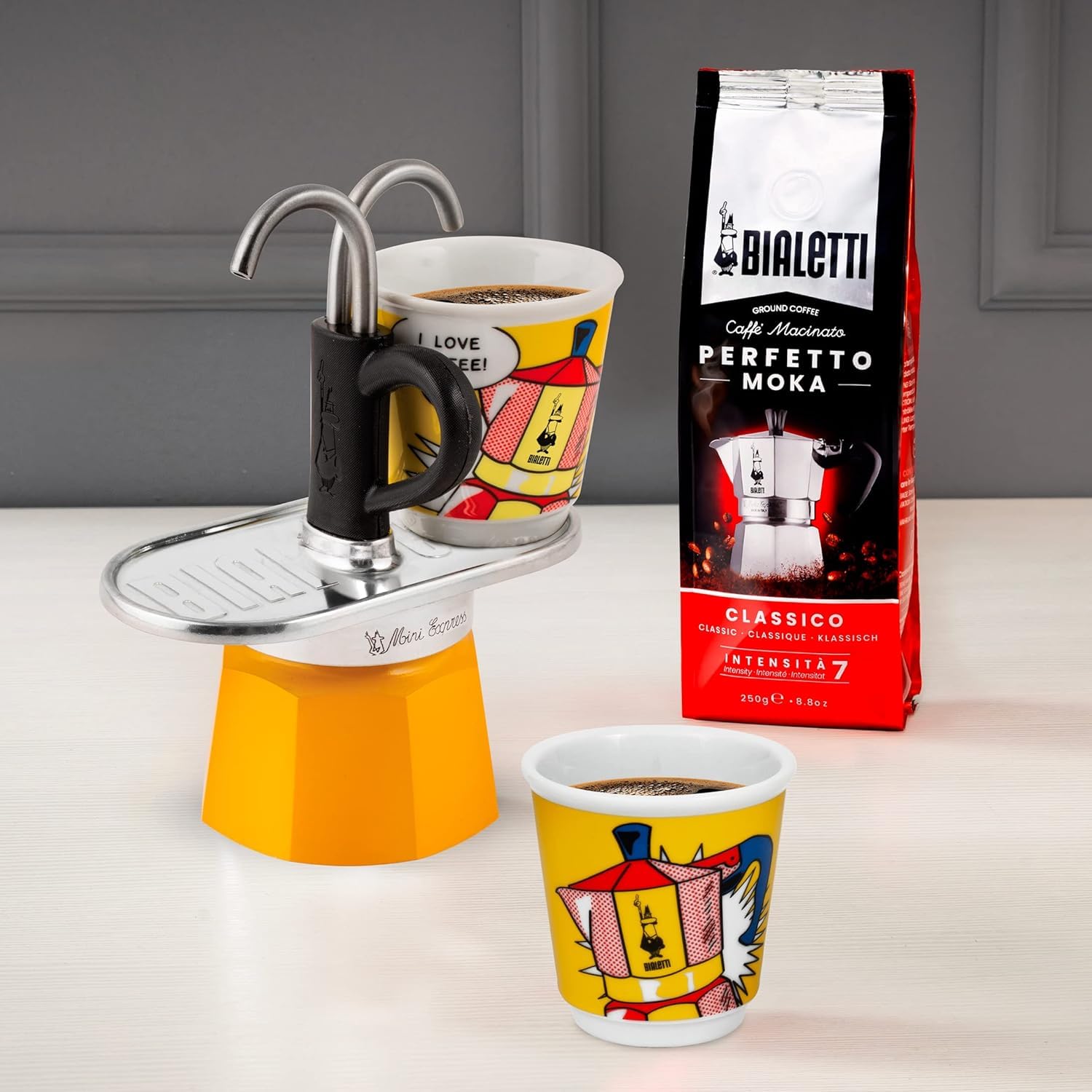 Bialetti two included glass cups on plate ready to receive espresso quickly