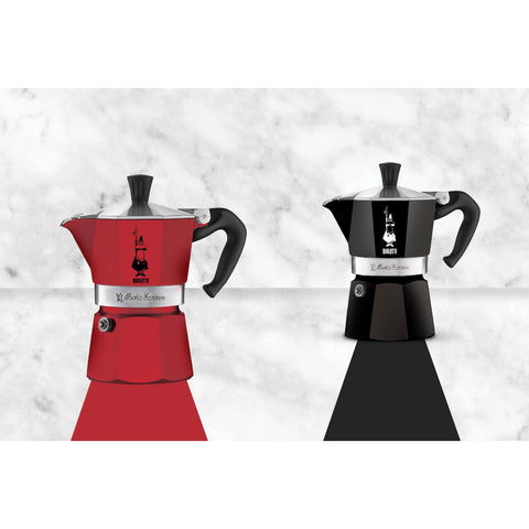 Bialetti Moka Express beside an espresso cup showing compact size and portability