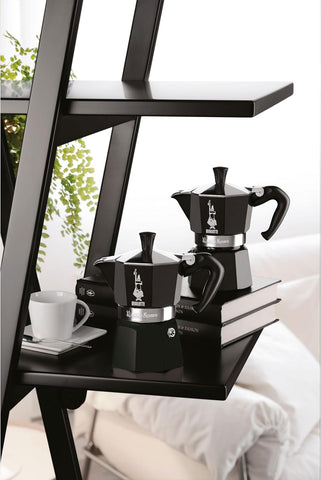 Bialetti next to espresso cups showing 6-cup capacity for small servings