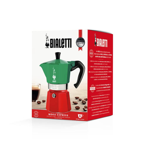 Bialetti next to espresso cups showing 6-cup capacity scale