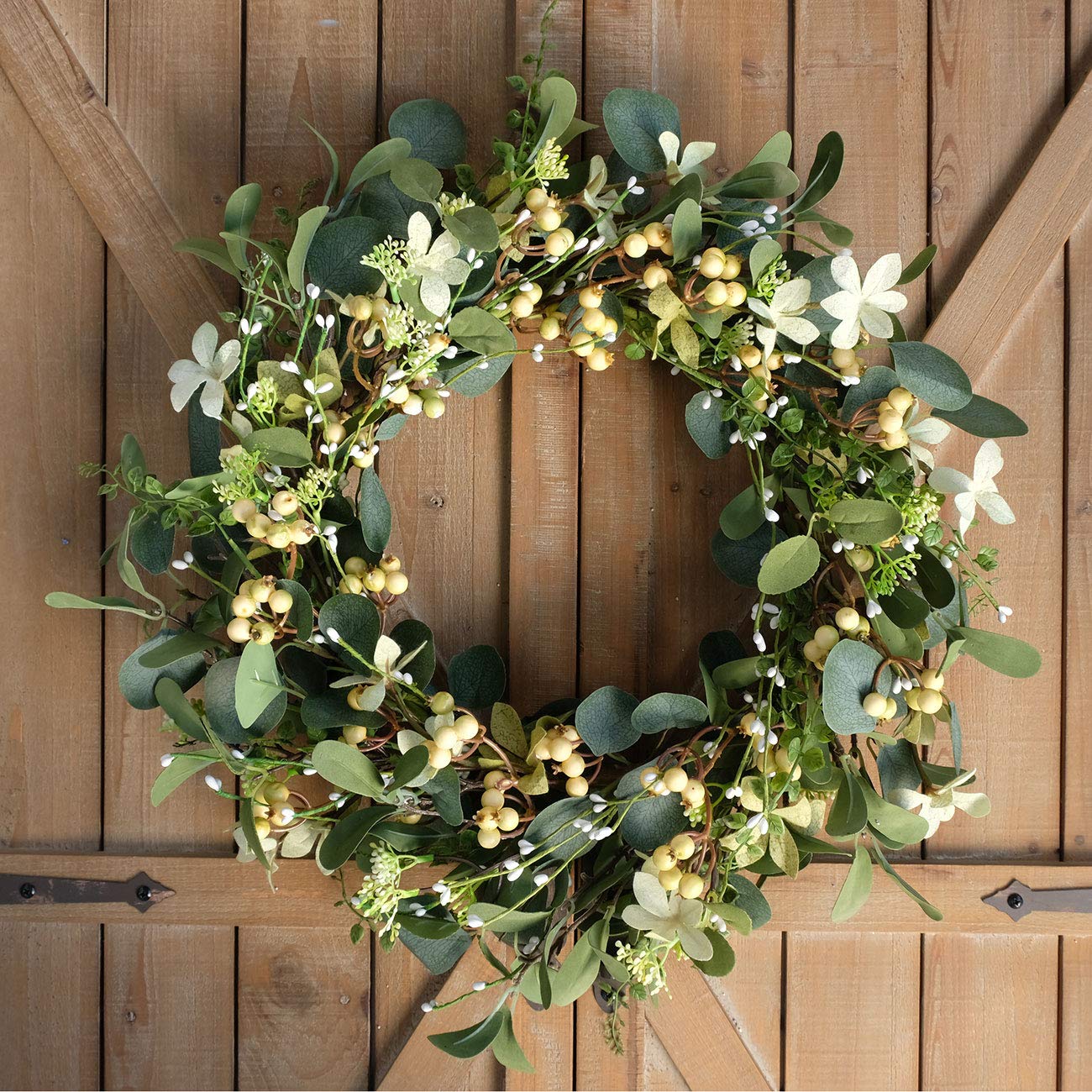 Bibelot wreath hung on a front door showing year-round charm and easy installation