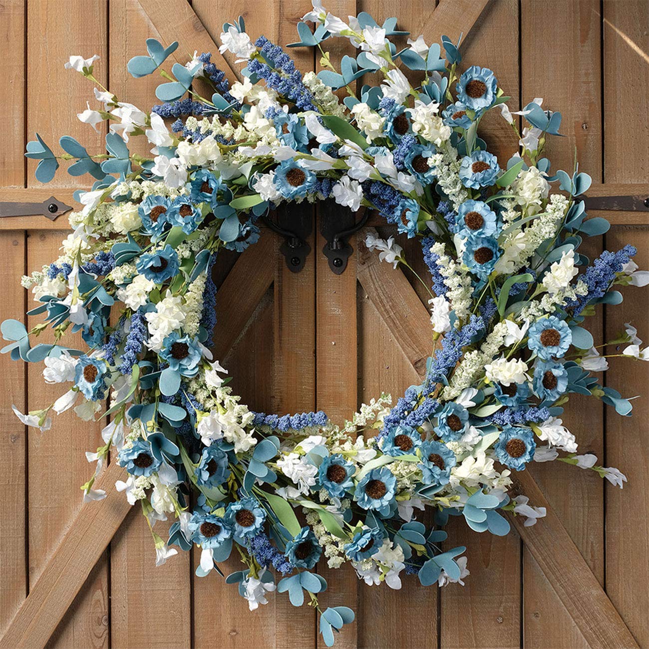 Bibelot front view wreath showing vibrant blue daisies and welcoming curb appeal