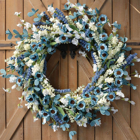 Bibelot front view wreath showing vibrant blue daisies and welcoming curb appeal