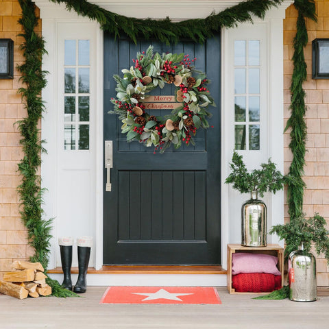Bibelot wreath displayed on a covered front door to show styling and welcome benefit