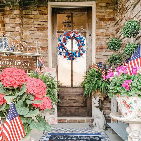 Bibelot wreath styled on mantel enhancing patriotic décor