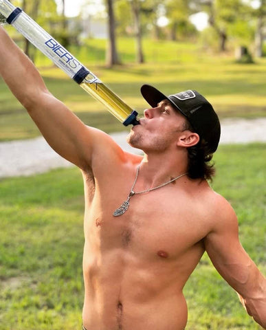 Person using Bierstick at a tailgate showing fast, controlled pouring