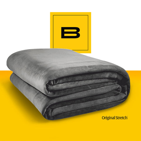 Big Blanket Co under stars at backyard movie showing portable, breathable warmth