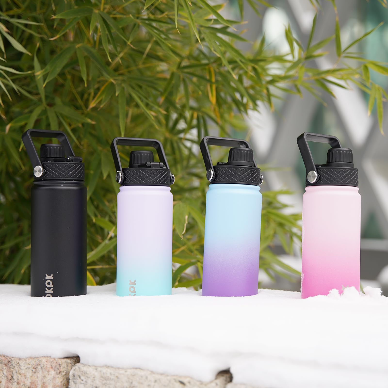 BJPKPK bottle held in hand to show 22oz size and portable convenience