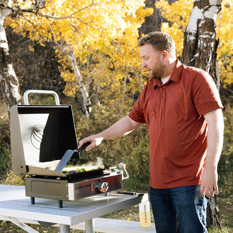 Blackstone griddle in use at a campsite cooking pancakes, fast outdoor meal prep