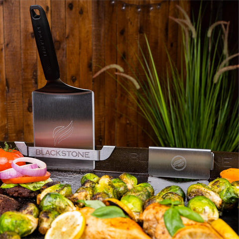 BLACKSTONE outdoor griddle in backyard showing tidy tool storage and organized cooking area