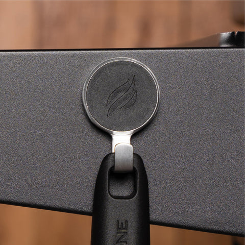 BLACKSTONE magnetic hooks on griddle cart holding utensils for convenient reach during cooking
