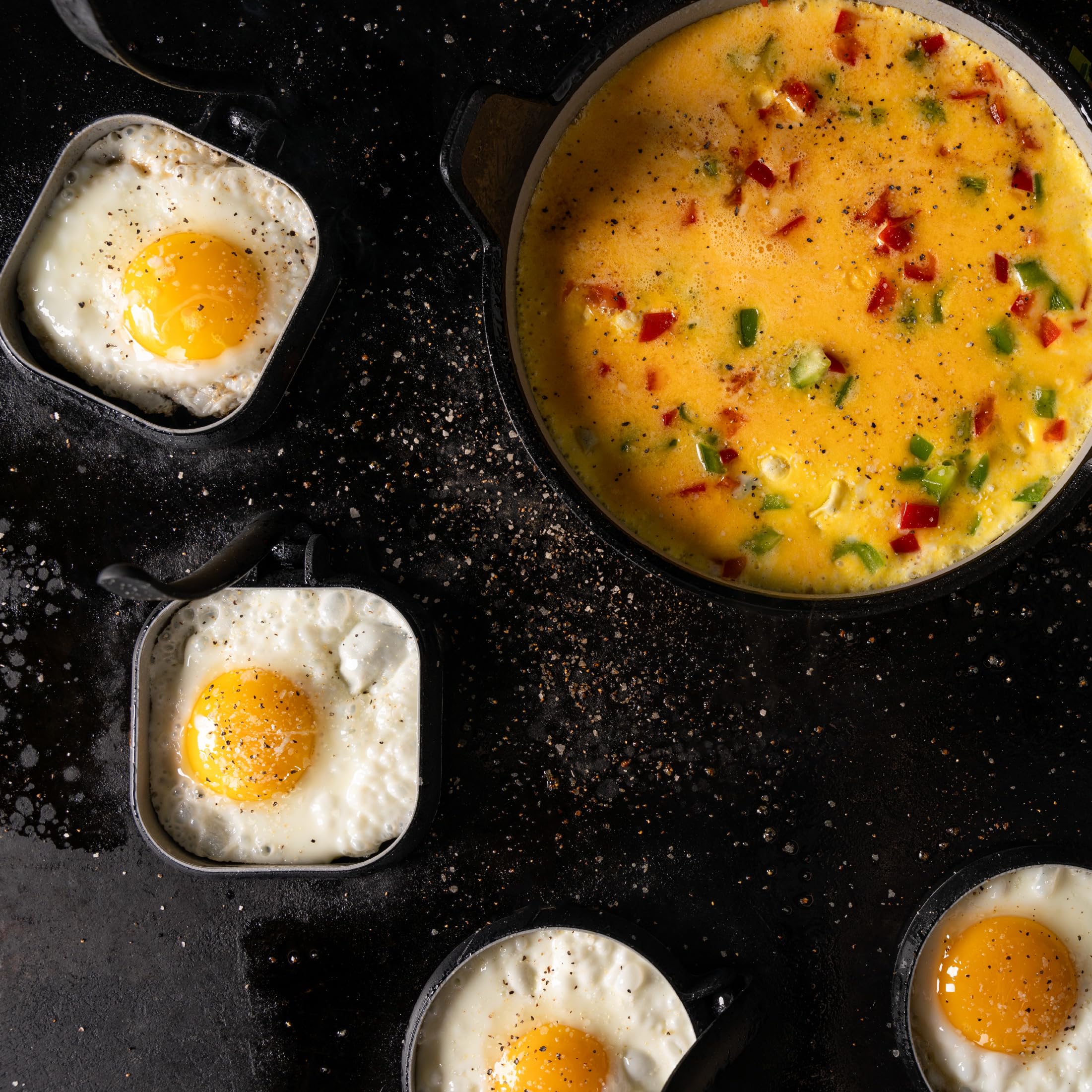 Blackstone rings on a hot griddle with eggs cooking for fast, even breakfasts