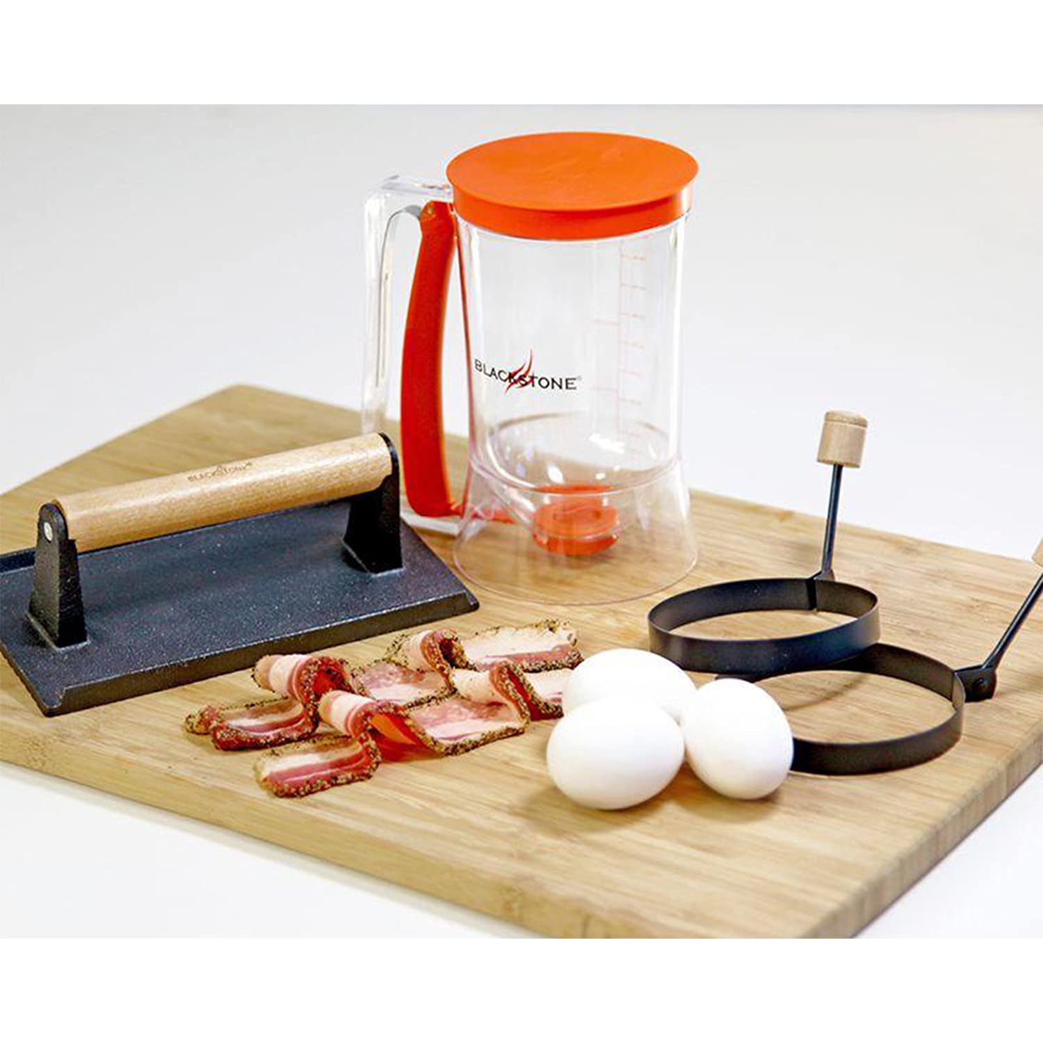 Blackstone tools on griddle in use delivering faster, tidy breakfast cooking