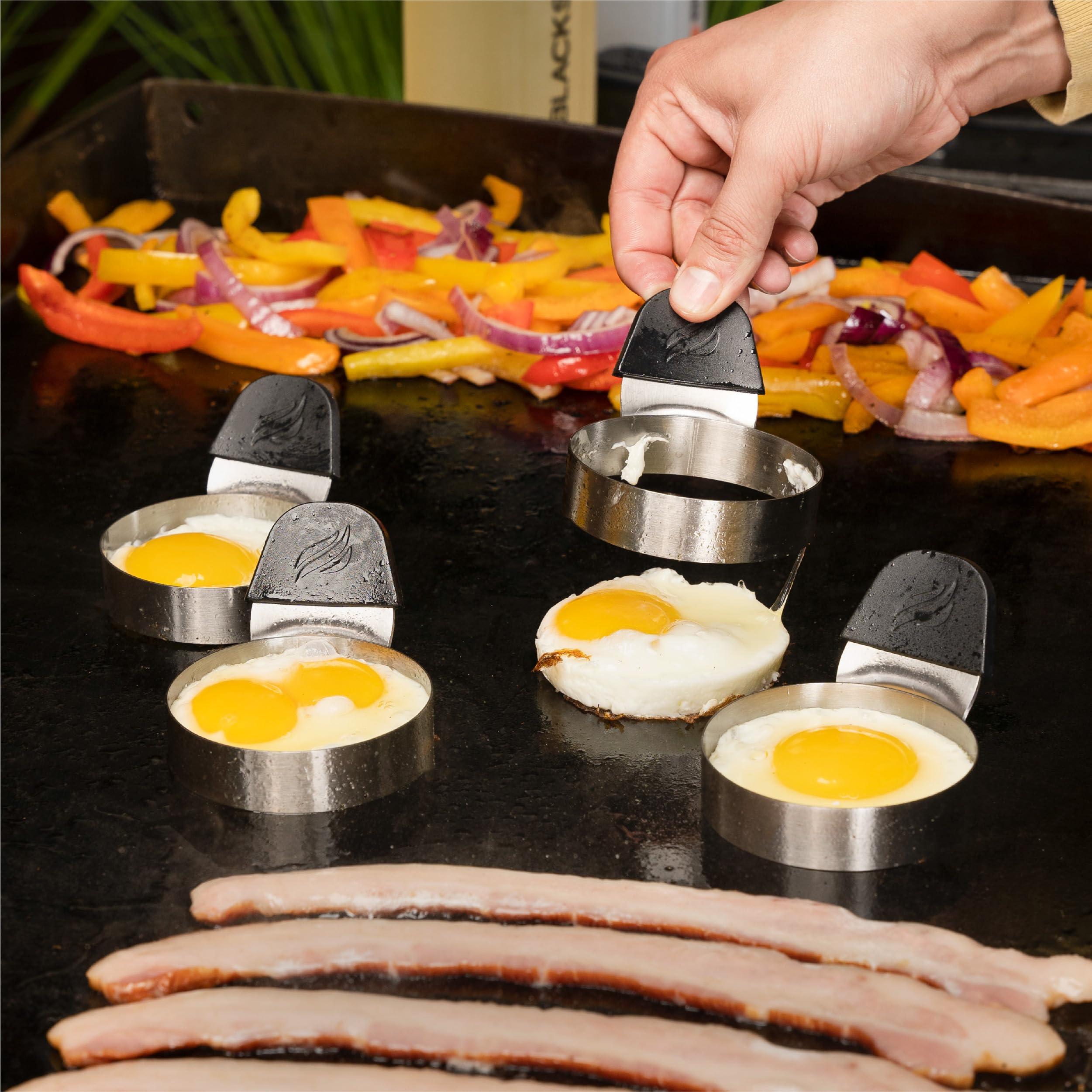 Blackstone wood crepe spreader in use creating thin even crepe batter