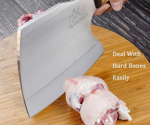 BLADESMITH cleaver in outdoor butcher setup illustrating rugged performance