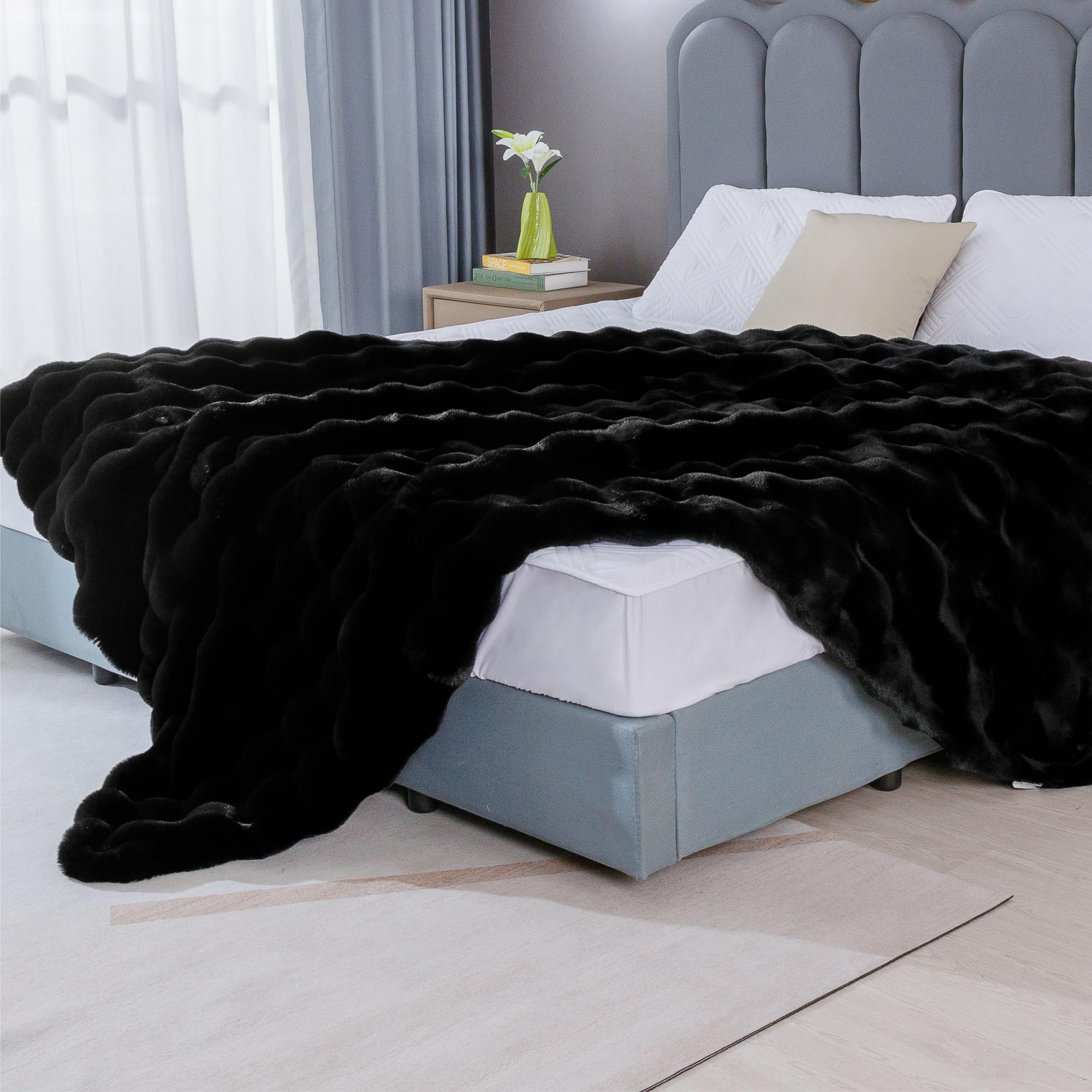 BlanketSolution styled on sofa adding cozy, modern decor appeal