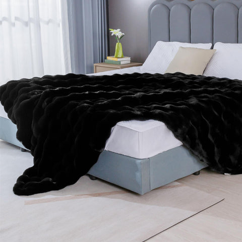 BlanketSolution styled on sofa adding cozy, modern decor appeal