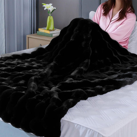 BlanketSolution person wrapped in throw showing warmth and relaxation