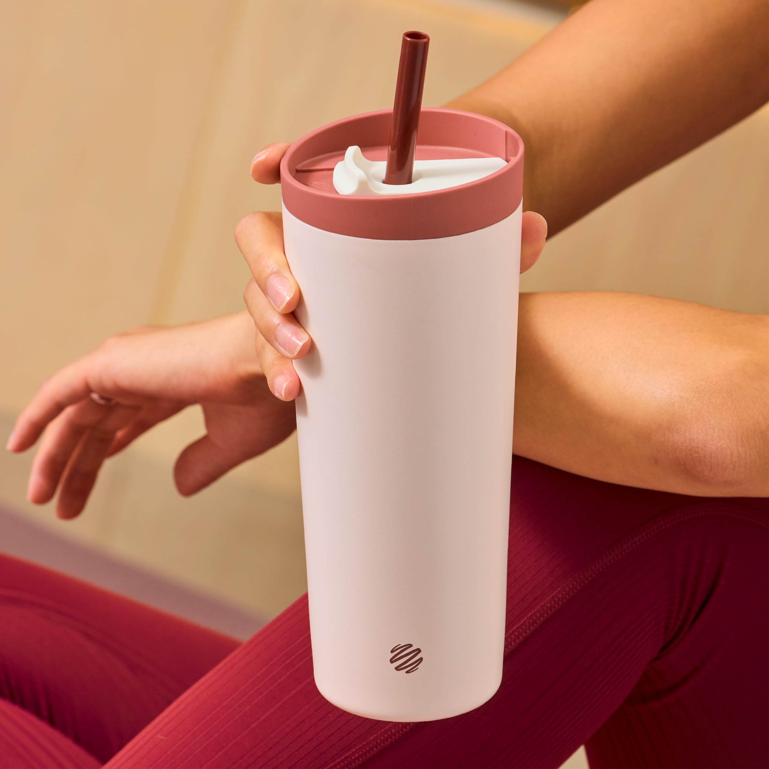 BlenderBottle tumbler held in hand for size comparison highlighting 24oz capacity and travel fit