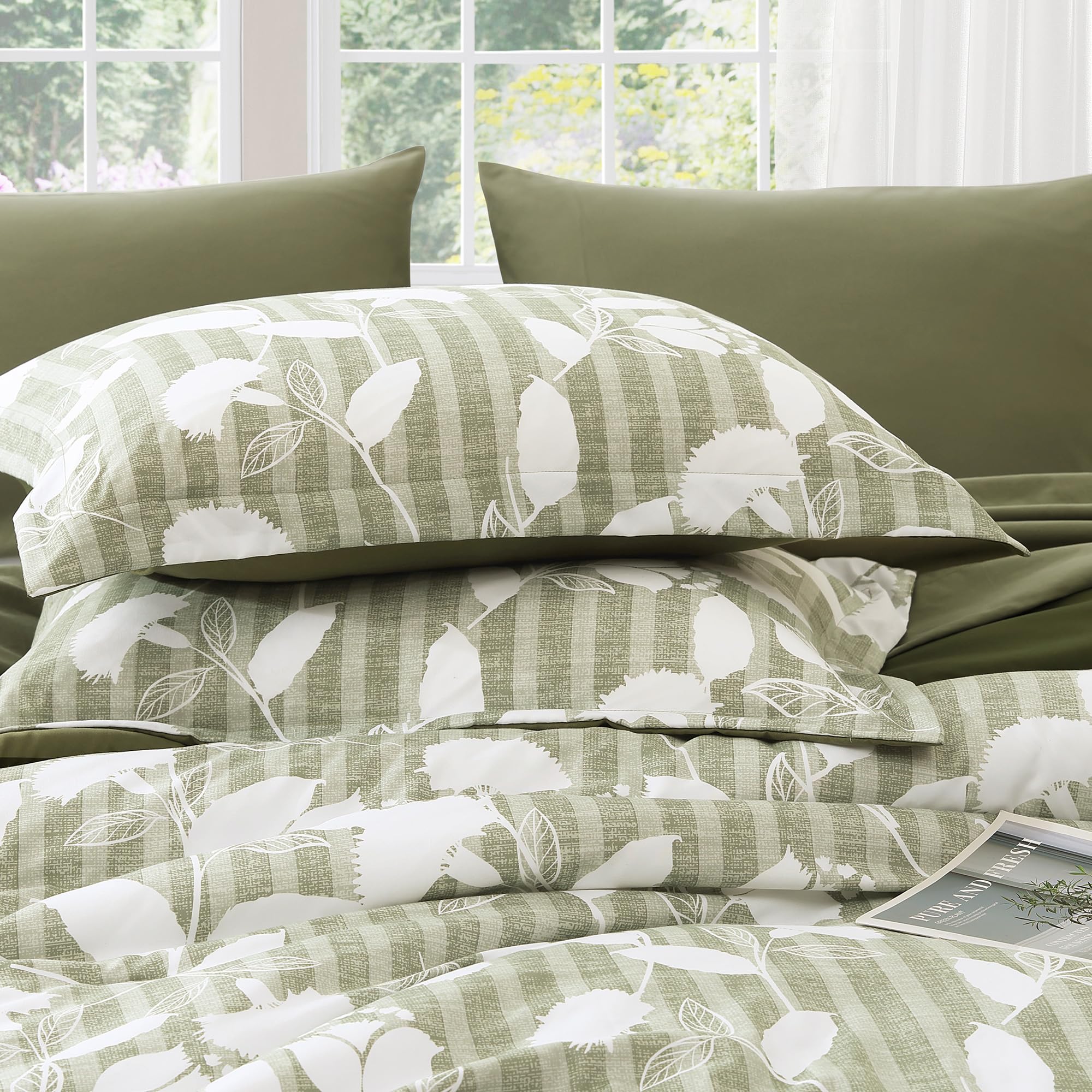 BLOOMHAVEN comforter showing generous drape and overhang for full queen coverage