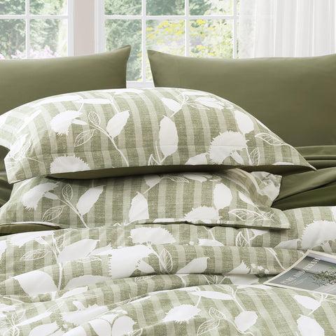 BLOOMHAVEN comforter showing generous drape and overhang for full queen coverage