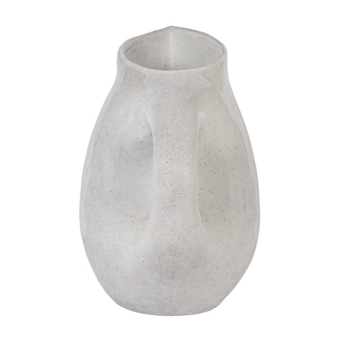 Bloomingville pitcher used as a vase with wildflowers creating a warm centerpiece