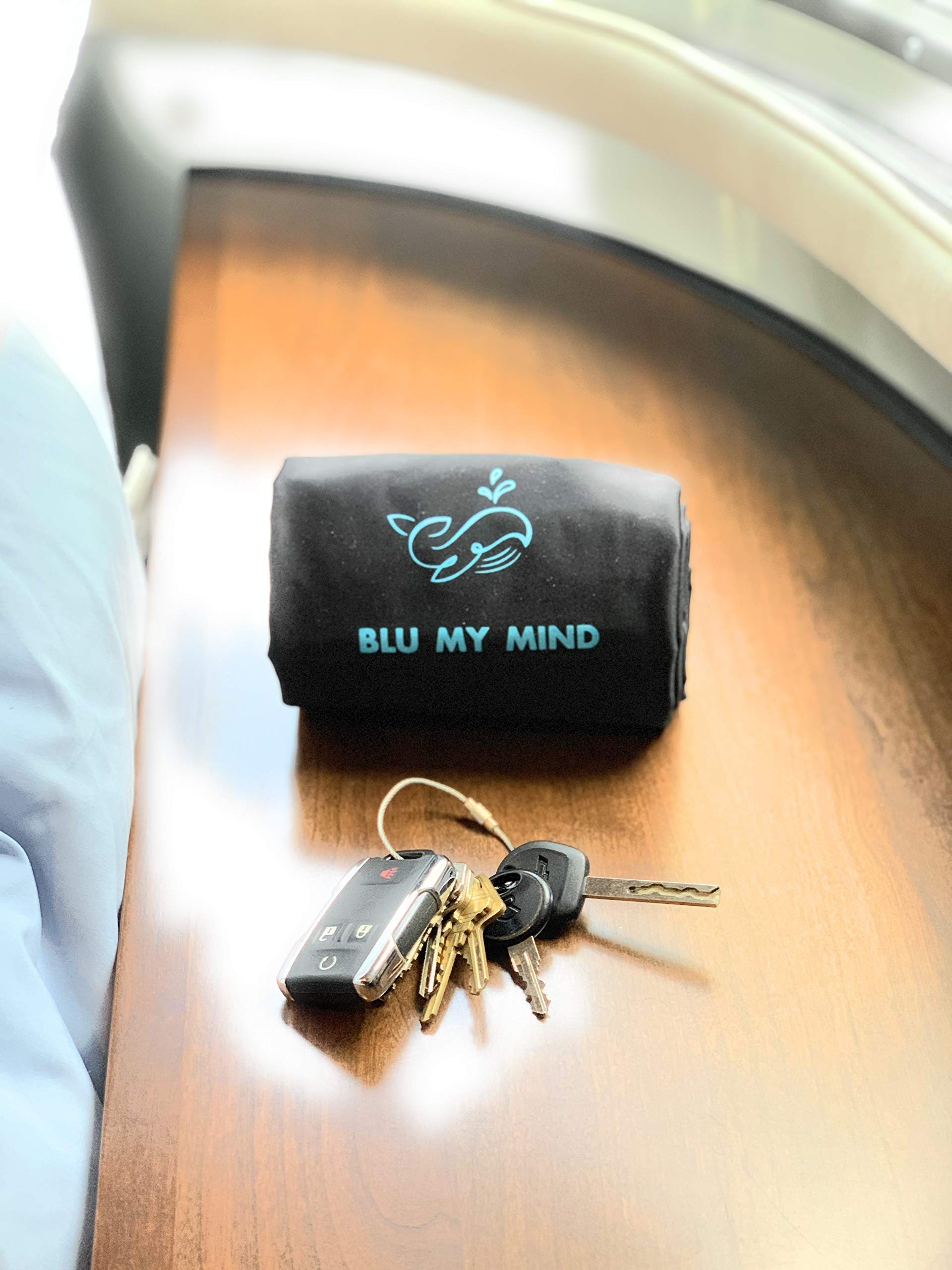 Blu My Mind folded pillow in drawstring bag illustrating compact packing convenience