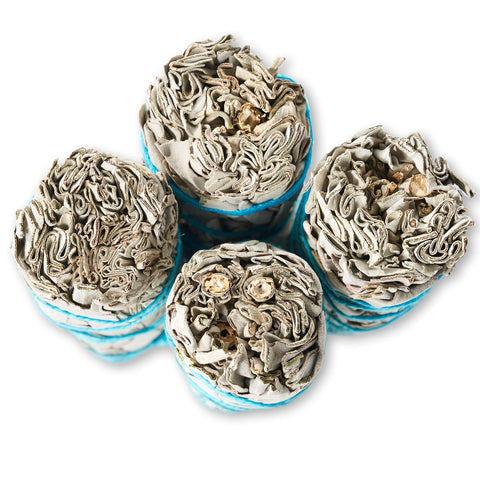 Blue River Sage bundle held in hand showing compact 4-inch size for travel