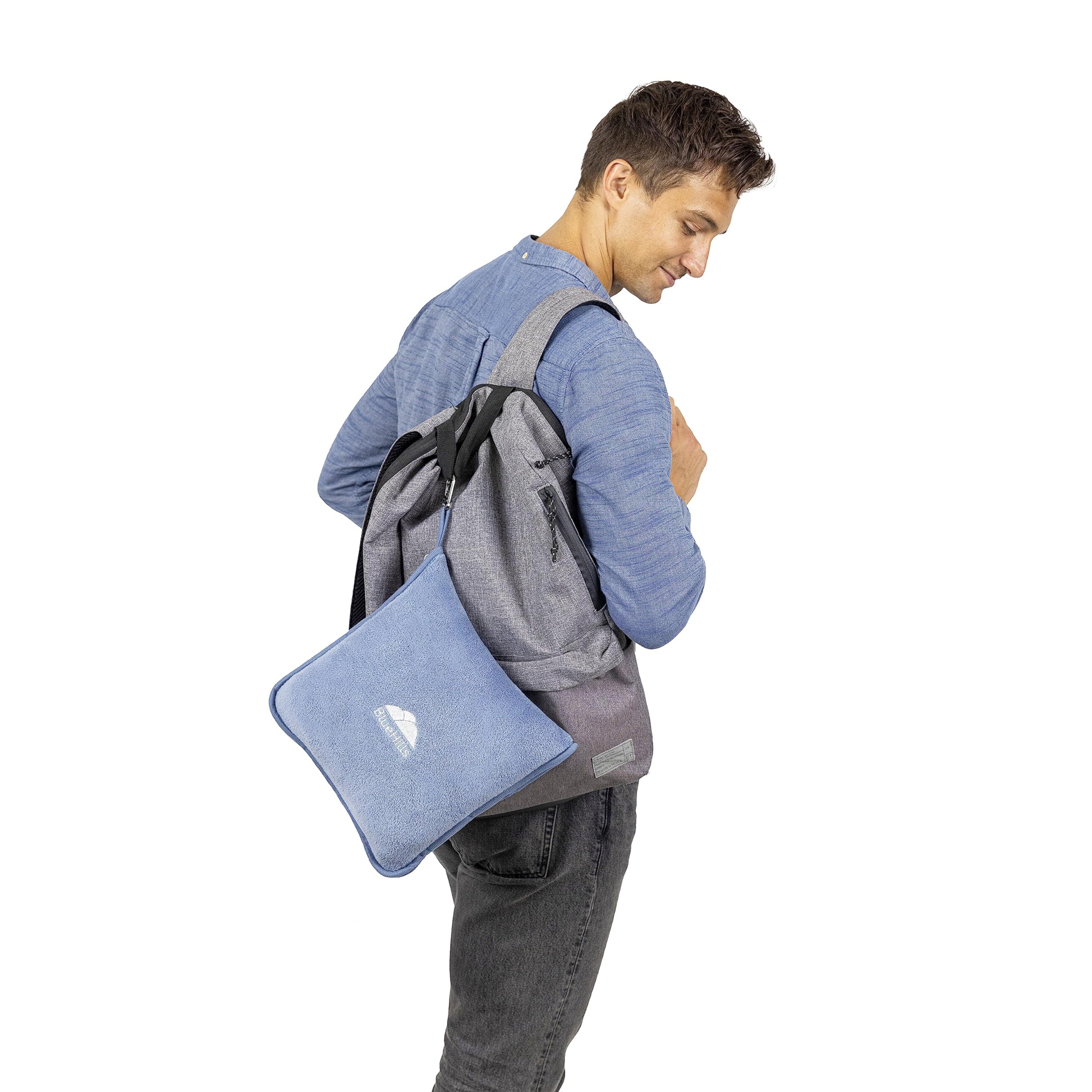 BlueHills blanket used on an airplane seat showing passenger comfort and neck support benefit