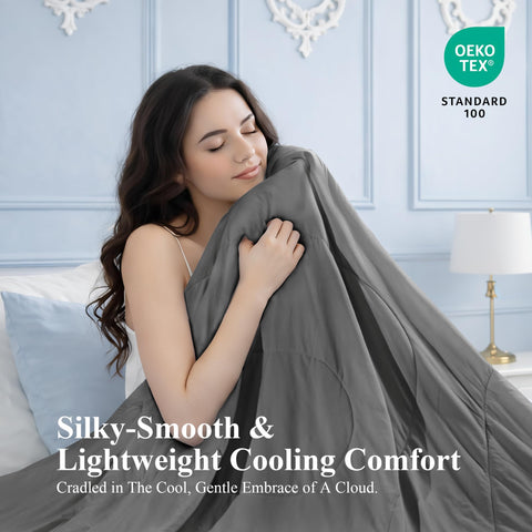 blunique comforter spread on queen bed in grey, provides breathable night comfort benefit