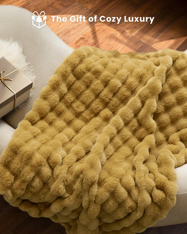 blunique full spread on bed showing 50x60 size and cozy coverage