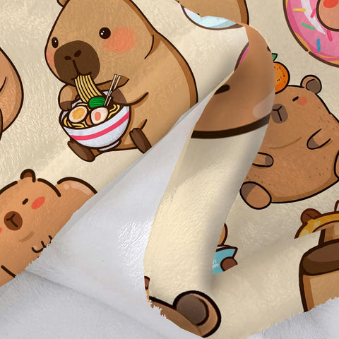 Bmaows capybara blanket in use with child snuggling on couch for warmth and charm